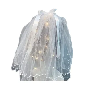 White double layer mesh bridal veil detail with pearl, bow and warm led lights decoration.