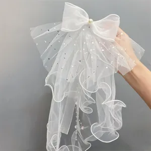 White mesh bow hair clip with pearls and rhinestones, double layer tulle flower girl veil.
