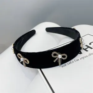 Elegant black velvet padded headband with sparkling rhinestone pearl bows for women and girls chic.