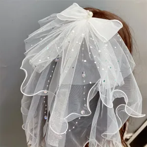 Stunning white double-layer mesh bow hair clip with sparkling sequins and delicate pearls.