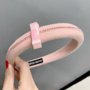 Pink padded headband with bow and sparkling pink rhinestones sweet chic hair accessory fashion