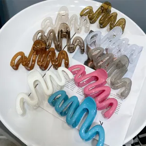 Detail view of colorful wavy hair claws, jelly style aesthetic hair accessories for women wear.