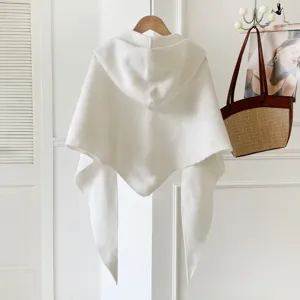 White hooded knit shawl detail, cozy winter cape, warm solid color outerwear layer.