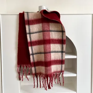 Cozy winter plaid scarf with fringe, thick warm classic tartan design for cold weather.