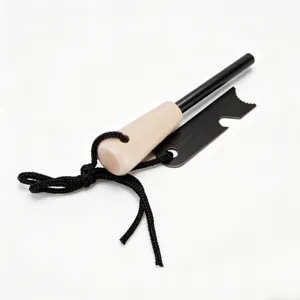 Outdoor survival fire starter tool detail view, wooden handle magnesium flint rod striker.