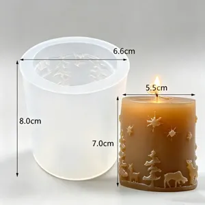 Silicone mold and Christmas candle detail view, showing embossed deer and snowflake patterns.
