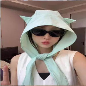 Details of the Y2K little devil horn balaclava hat in light green. Cute and stylish design.