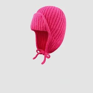 Pink knitted bomber hat, thick warm earflap winter beanie with cute ties for women style.