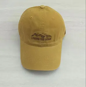 Close-up of the embroidered mountain graphic and text detail on the stylish baseball cap.