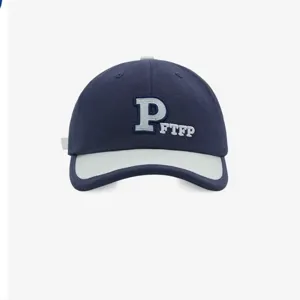 Classic navy blue baseball cap with contrast brim and stylish embroidered letter P front design.