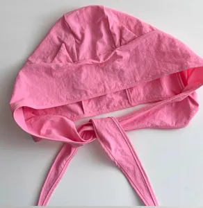 Detailed shot of the pink Y2K devil horn headwrap hat, showing unique stitching and ties.
