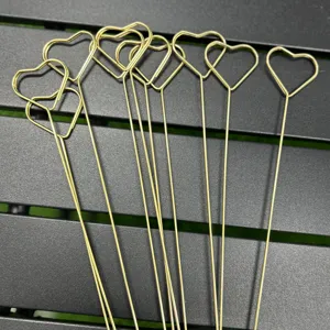Gold heart metal card clip detail shot, showing durable wire floral pick design for arrangement.