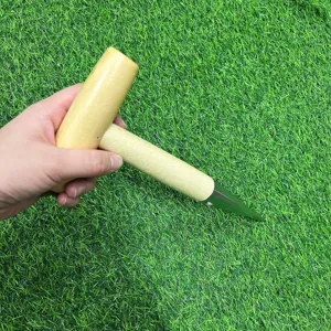 Ergonomic T-shaped wooden handle garden dibber for efficient soil punching and planting seeds.