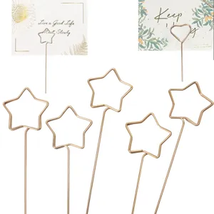 Rose gold metal wire card holders, star and heart shaped floral picks for memo display.