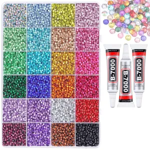 Colorful flatback resin rhinestones set with storage box and glue for DIY nail art and crafts.