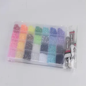 Detailed view of the multi-grid resin rhinestones, glue, and DIY nail art tool set.