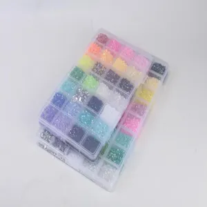 Detailed view of colorful 3mm flatback resin rhinestones in clear storage boxes for nail art DIY.