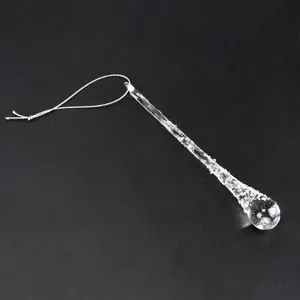 Transparent glass icicle pendant close-up, perfect for Christmas tree decoration detail.