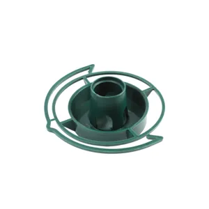 Close-up detail of green plastic bird feeder base tray, durable material for garden use.