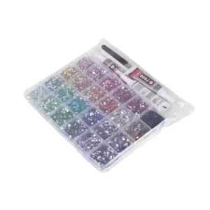 Multigrid resin rhinestones set with glue and tools for nail art and DIY phone case crafts.