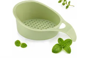 Mini plastic colander for washing fruits and vegetables, small kitchen drain basket green.
