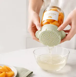 Silicone can strainer detail shot, kitchen gadget with double ears for easy fruit draining.