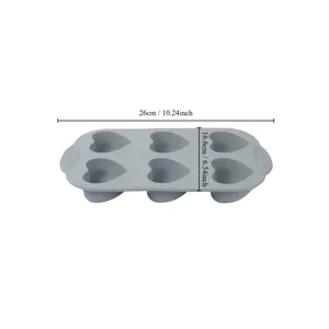 Silicone heart-shaped cake mold detail view, flexible baking pan featuring six cavities.