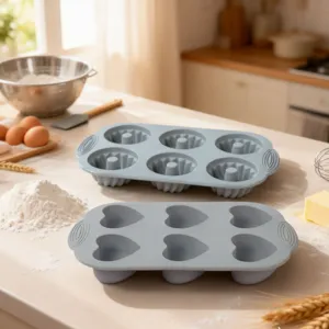Silicone baking mold set detail view showing fluted and heart shaped kitchen cake pans.