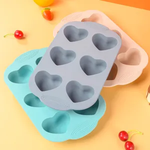 Silicone cake mold detail showing 6-cavity heart baking tray for kitchen desserts.