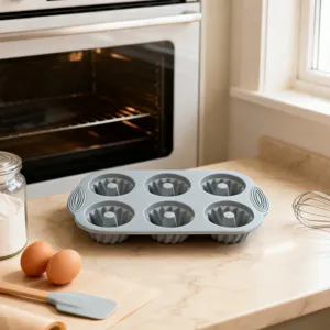 Silicone cake mold 6-cup baking pan kitchen tool for cupcakes, muffins, and puddings.