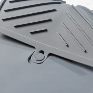 Silicone kitchen drying mat with raised ridges for fast drainage, non-slip heat resistant dish pad.
