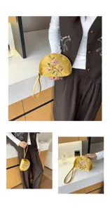 Nahaufnahme der Samt Blumen Stickerei Clutch Tasche Detail, feine Arbeit mit Handschlaufe.