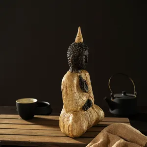 Zen resin sitting Buddha ornament detail showing wood texture and meditative aesthetic design.