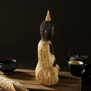 Zen resin Buddha statue detail view, artistic home decor ornament for meditation and tea room.
