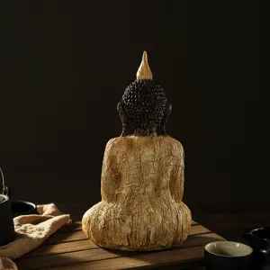 Wood grain resin sitting Buddha statue detail shot, zen aesthetic decor for home.