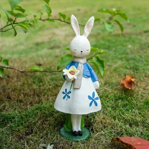Resin rabbit figurine holding flower, creative home decor ornament for desktop or garden gift.