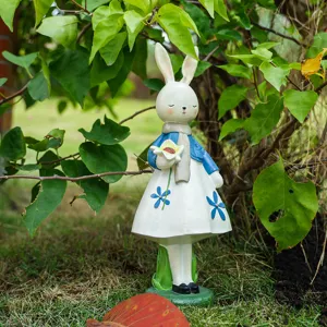 Resin rabbit ornament holding flower, cute desktop decor, eco-friendly gift, garden display.
