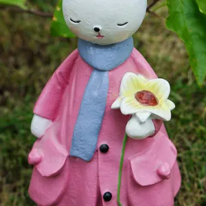 Resin rabbit figurine holding flower close up detail home decor ornament cute desk decoration