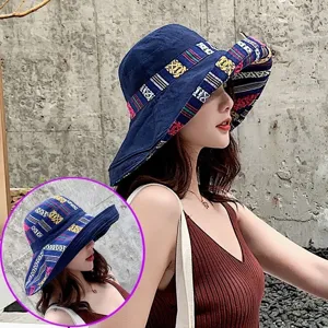 Ethnic style wide brim sun fisherman hat for women, blue cloth with colorful pattern ribbon.
