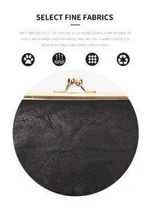 Detail view of vintage black kiss-lock wallet showcasing fine leather texture and golden metal clasp.