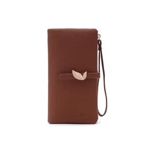 Brown PU long wallet for women with elegant gold leaf buckle and convenient wrist strap.
