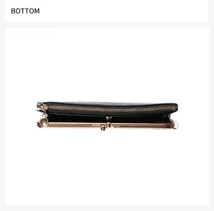 Detailed bottom view of the retro black long wallet showing metal clasp and zipper design.