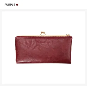 Detailed view of the vintage purple long wallet with kiss lock closure and zipper design.