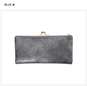 Close-up detail of the retro long kiss-lock wallet in dark blue, showing metal clasp and zipper.