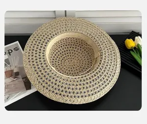 Detailed view of a vintage hollow straw hat, elegant flat top design, summer beach sun protection.