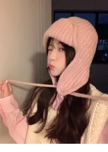 Pink knitted trapper hat for women, cute winter warm bomber hat with earflaps and cute ties.