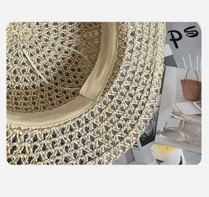 Detailed view of women's summer woven straw hat, retro flat top beach sun hat texture.