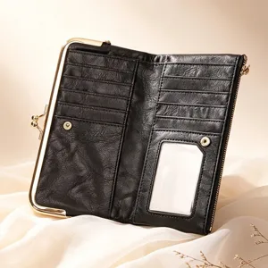 Retro kiss-lock long women's wallet with multiple card slots and elegant black leather design.