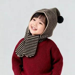 Close-up detail of the kids striped knitted hooded scarf hat with cute pom-pom design.