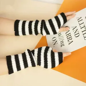Knit fingerless gloves black white striped arm warmers detail shot showing soft texture.